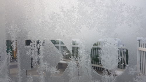 Wet glass window in winter