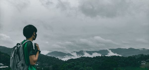 Rear view of man looking at mountain