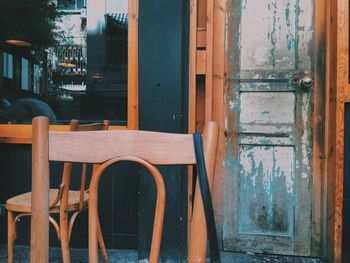 Close-up of chairs on table