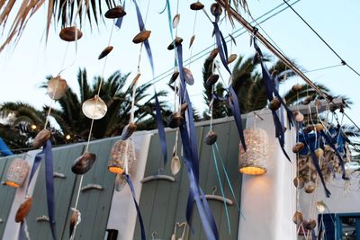 Low angle view of clothes hanging against sky