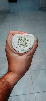 High angle view of hand holding bread