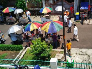 High angle view of people walking in town square