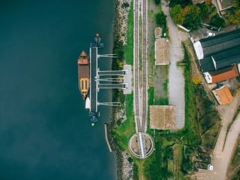 High angle view of old train station and a boat on a river