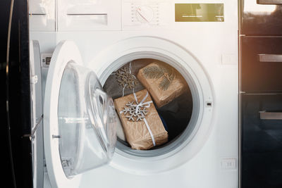 High angle view of woman standing in washing machine