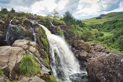 Scenic view of waterfall in forest