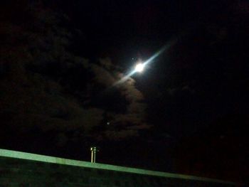 Low angle view of illuminated street light at night