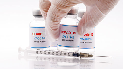 Close-up of human hand over white background