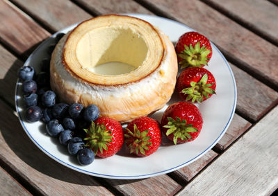 Close-up of fruits in plate on table