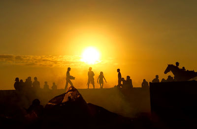 Silhouette people standing on observation point