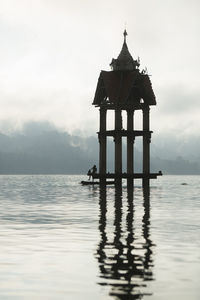 Man standing by in river