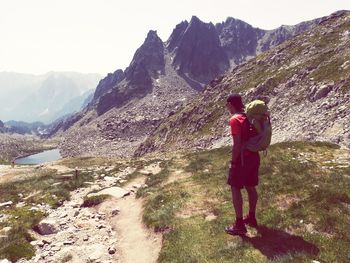 Rear view of friends standing on mountain