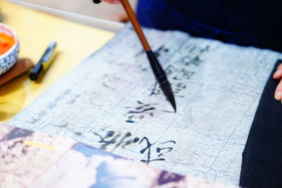 High angle view of paper on table