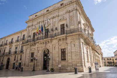 Historic buildings with beautiful facades in piazza duomo in ortigia