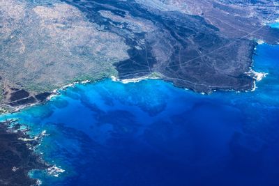 High angle view of rock formation in sea