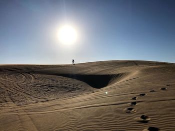 View of desert against clear sky