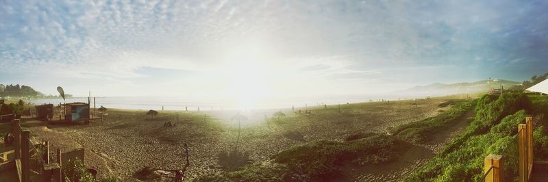 Panoramic view of landscape with sea in background