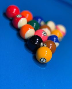 High angle view of multi colored snooker balls on table