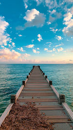 Pier over sea against sky
