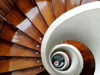 Directly below shot of wooden spiral staircase