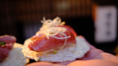 Close-up of hand holding strawberry