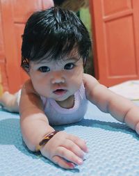 Portrait of cute baby girl at home