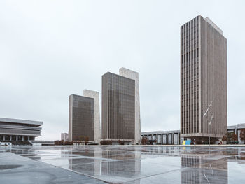 Modern buildings in city against clear sky