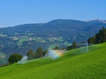 Scenic view of landscape and mountains against sky