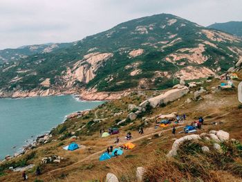 High angle view of people on land against mountains