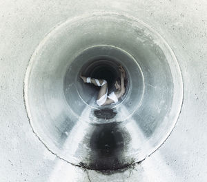 High angle view of man standing in tunnel