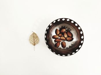 High angle view of pastries on table against white background