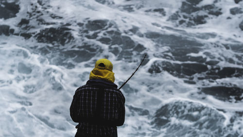 Rear view of man in water