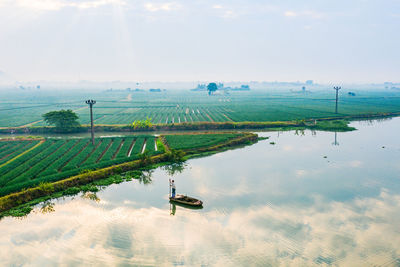 High angle view of agricultural landscape against sky