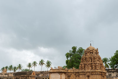 View of temple building against cloudy sky