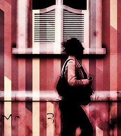 Woman standing in front of building