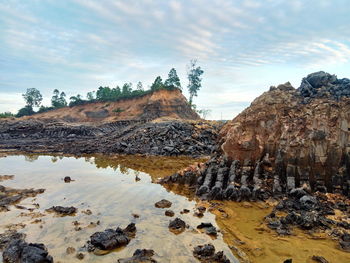 Rocks on land against sky