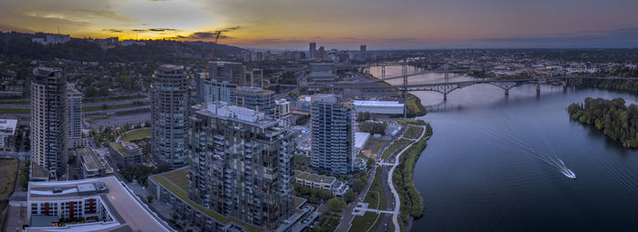 High angle view of city buildings during sunset