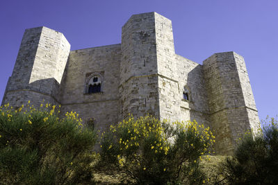 Low angle view of old ruins against clear sky