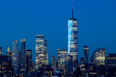 Illuminated buildings in city at night