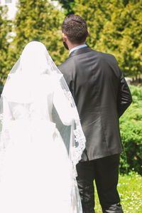 Rear view of couple standing outdoors