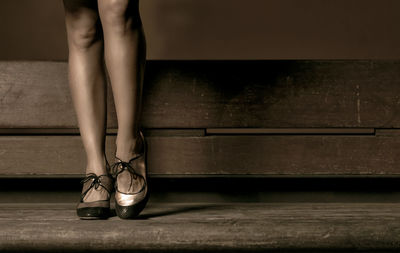 Low section of woman standing on floor