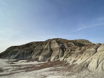 Rock formations on landscape against sky