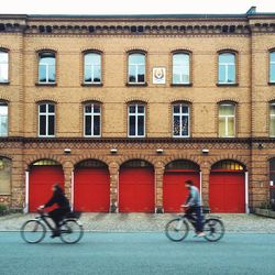 Man riding bicycle parked on road