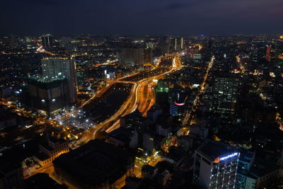 High angle view of illuminated city buildings at night