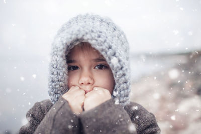 Portrait of cute girl in standing outdoors during winter