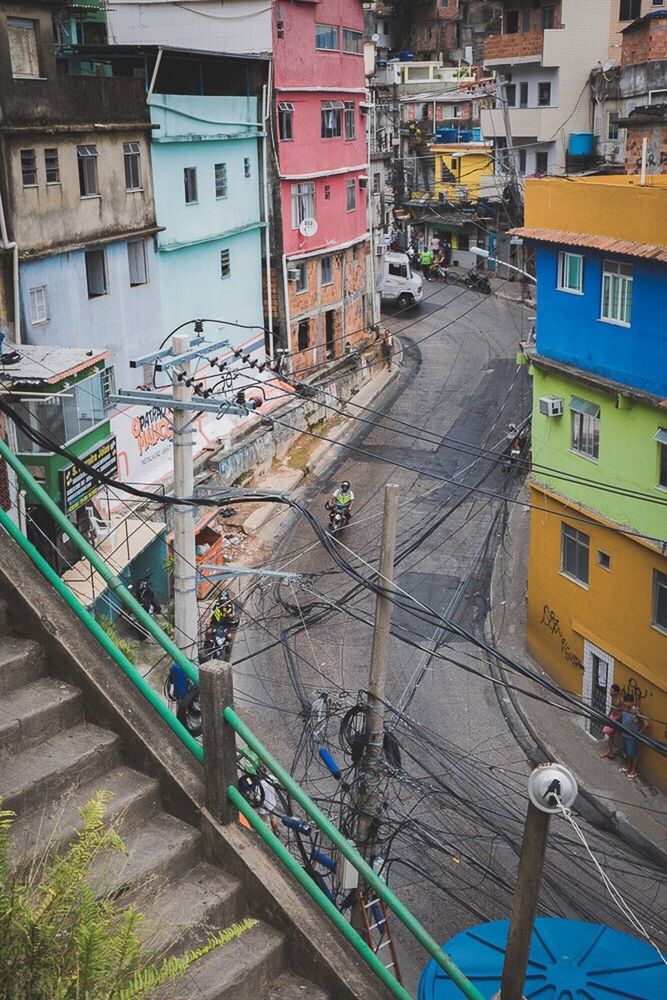 HIGH ANGLE VIEW OF STREET AMIDST CITY