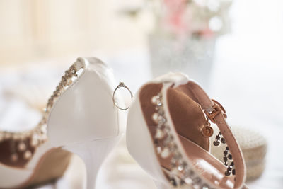 Close-up of high heels on table