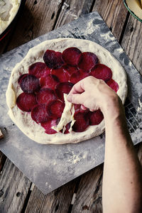 Cropped hand of woman holding dessert