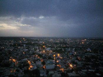 Aerial view of illuminated cityscape at night