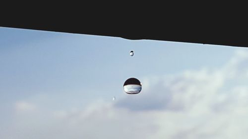 Low angle view of raindrops in sky