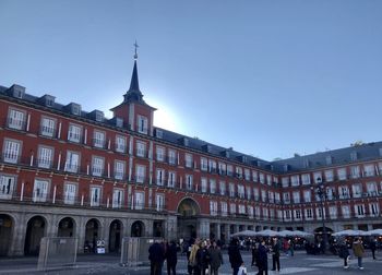 Group of people in front of building in city